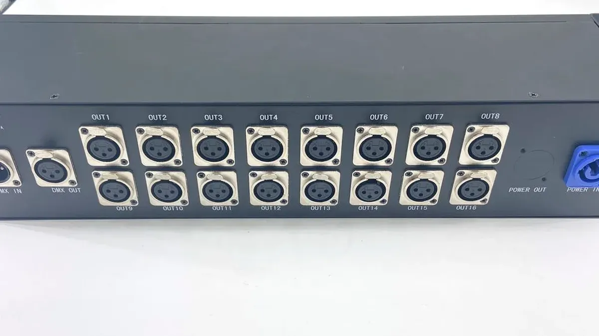 Rear panel of a 16-port Art-Net DMX controller showing outputs numbered OUT1 to OUT16 plus DMX in and out, the port count that sets how many fixtures one unit can drive