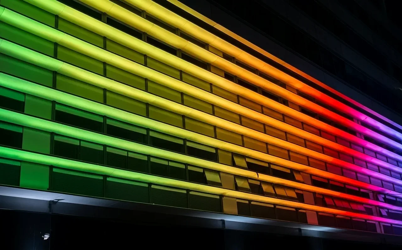 Second view of the German facade showing a rainbow gradient wash — one of many programmable DMX states